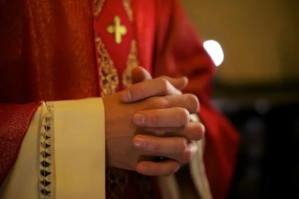 catholic-priest-on-altar-praying-during-mass-2021-08-26-15-46-09-utc.jpg